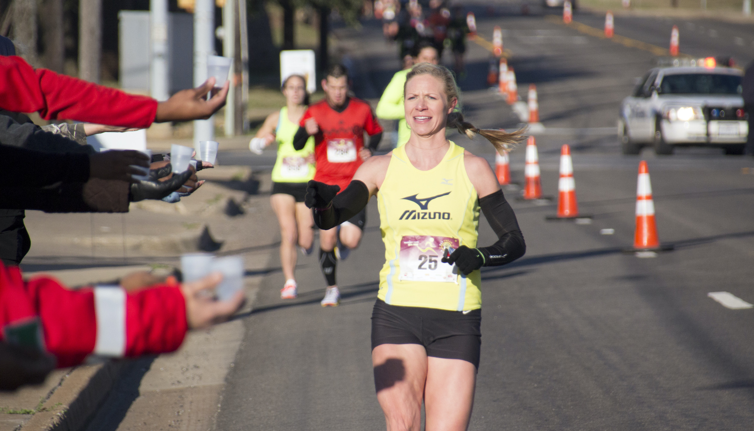 Participant Reaching for Water During Brookshire's Annual Fresh Run